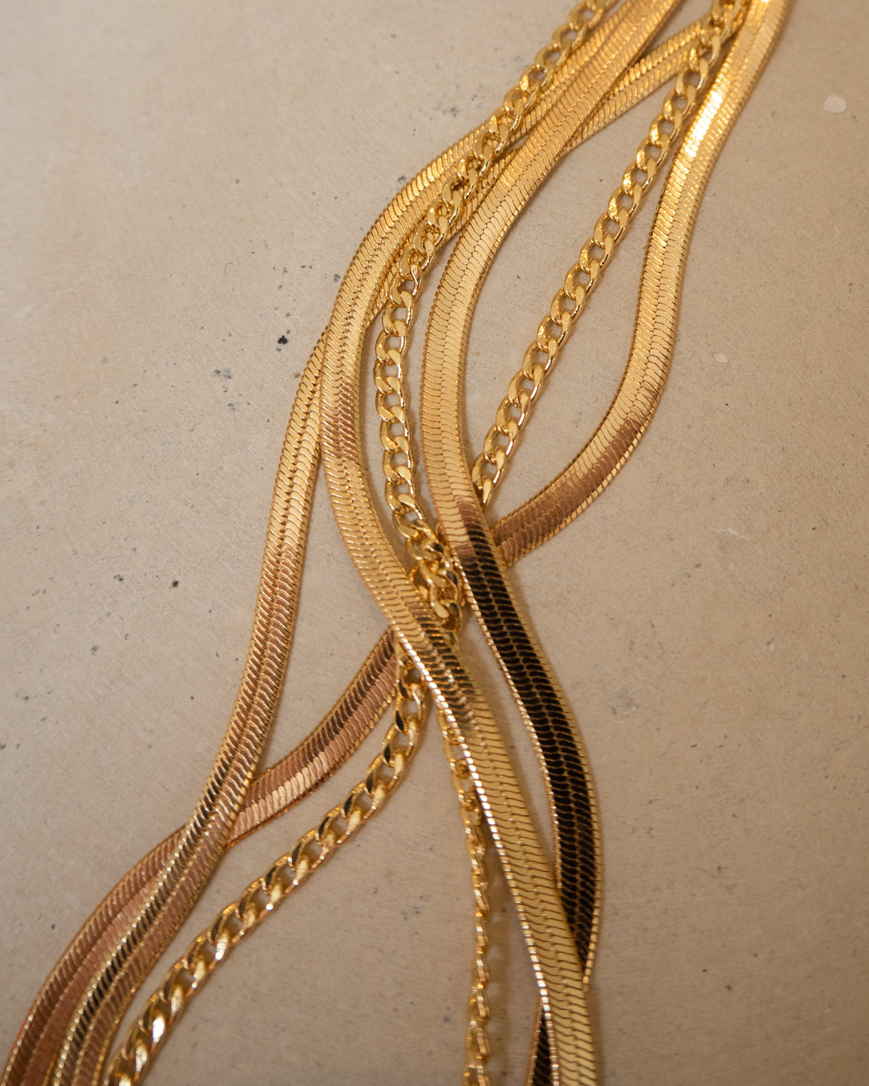 Dainty medium cuban link layering chain in 14k gold filled by Vie en Bleu jewelry. Dainty curb chain, dainty layering chain, 14k, 18k, gold filled chain, gold filled layering chain, mini curb chain, dainty cuban chain, mini curb link necklace, gold filled dainty jewelry, gold filled dainty, dainty necklace, gold layering necklace chain, water resistant, dainty jewelry, dainty necklace