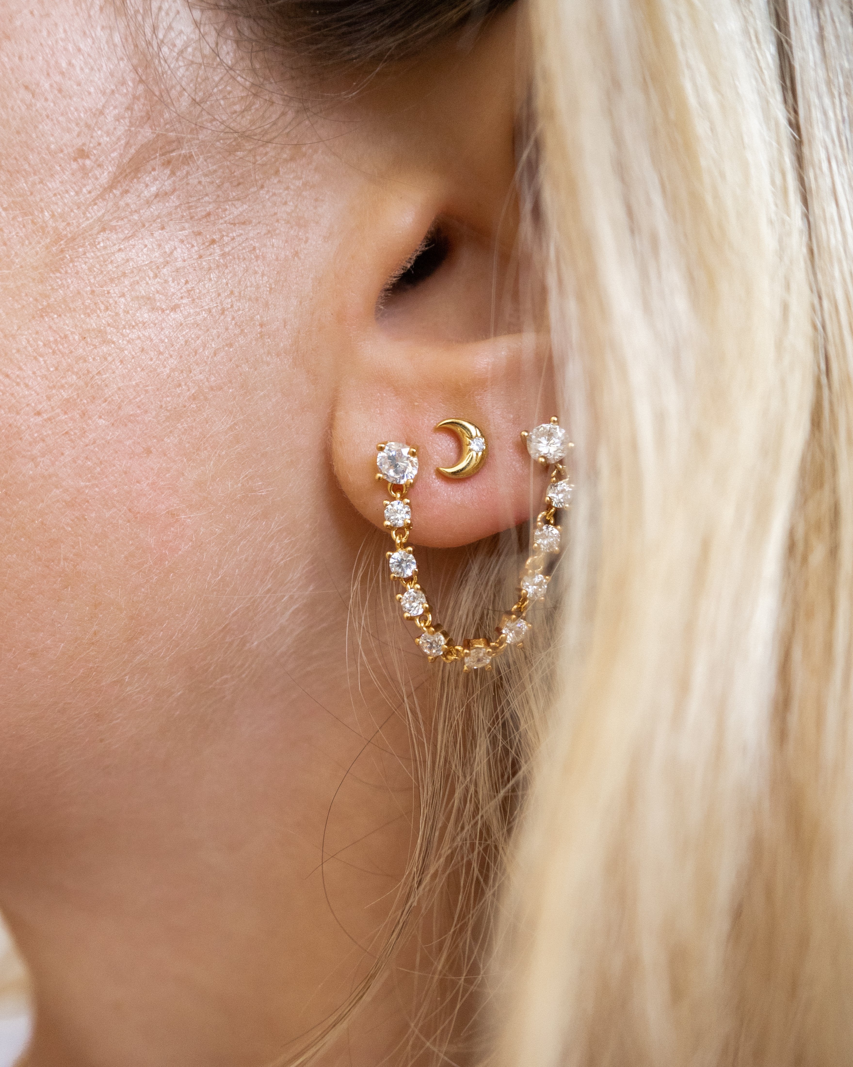 dainty mini moon stud earrings in gold by vie en bleu jewelry.