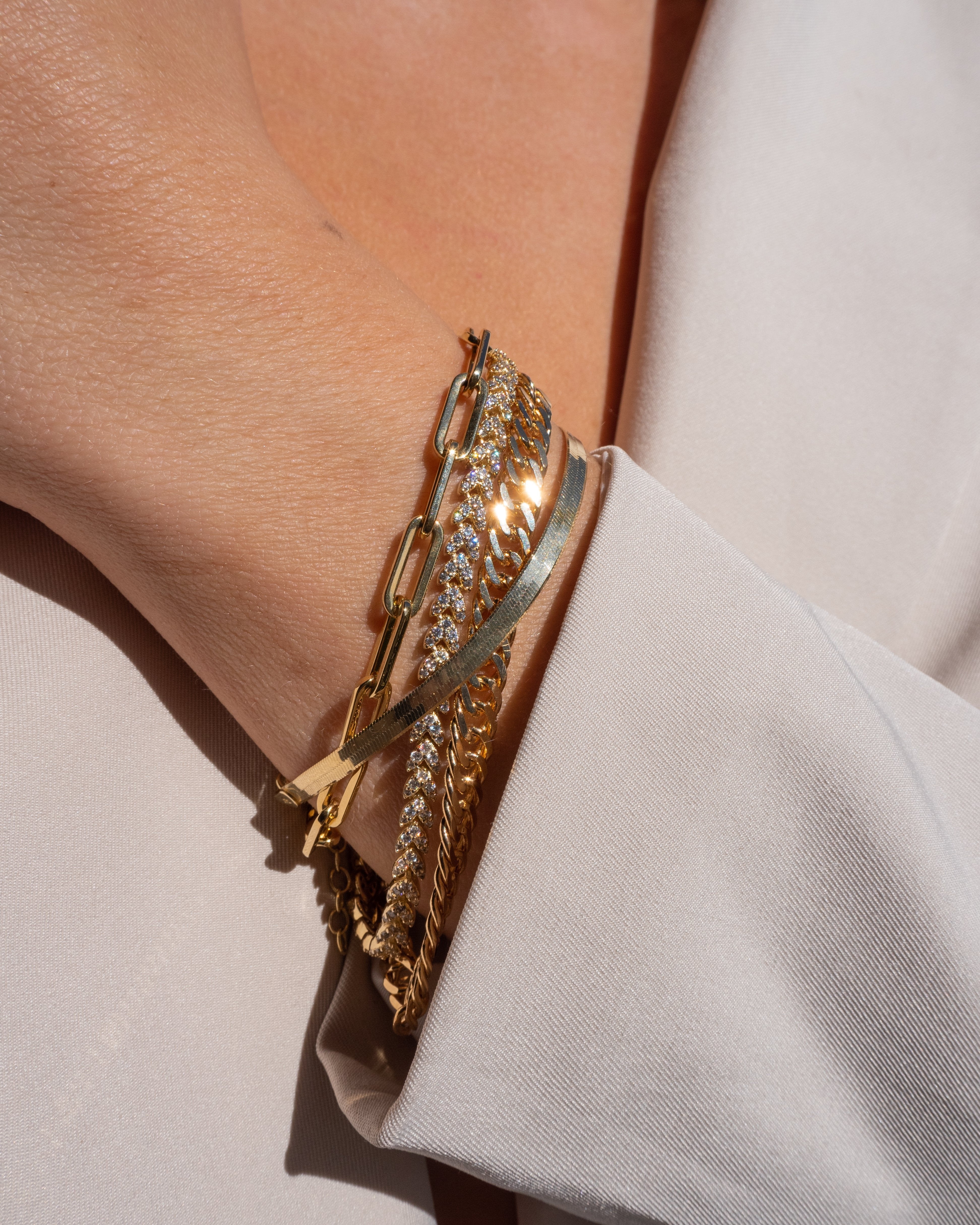 Dainty chunky stacking bracelets in gold by vie en bleu jewelry. dainty bracelet, gold herringbone, herringbone bracelet, gold dainty bracelet, gold bracelet, dainty, dainty bracelet gold, snake herringbone, snake bracelet, snake chain, herringbone chain, flat herringbone, gold filled, gold filled bracelet, gold fill, water resistant bracelet, tarnish resistant bracelet, waterproof bracelet