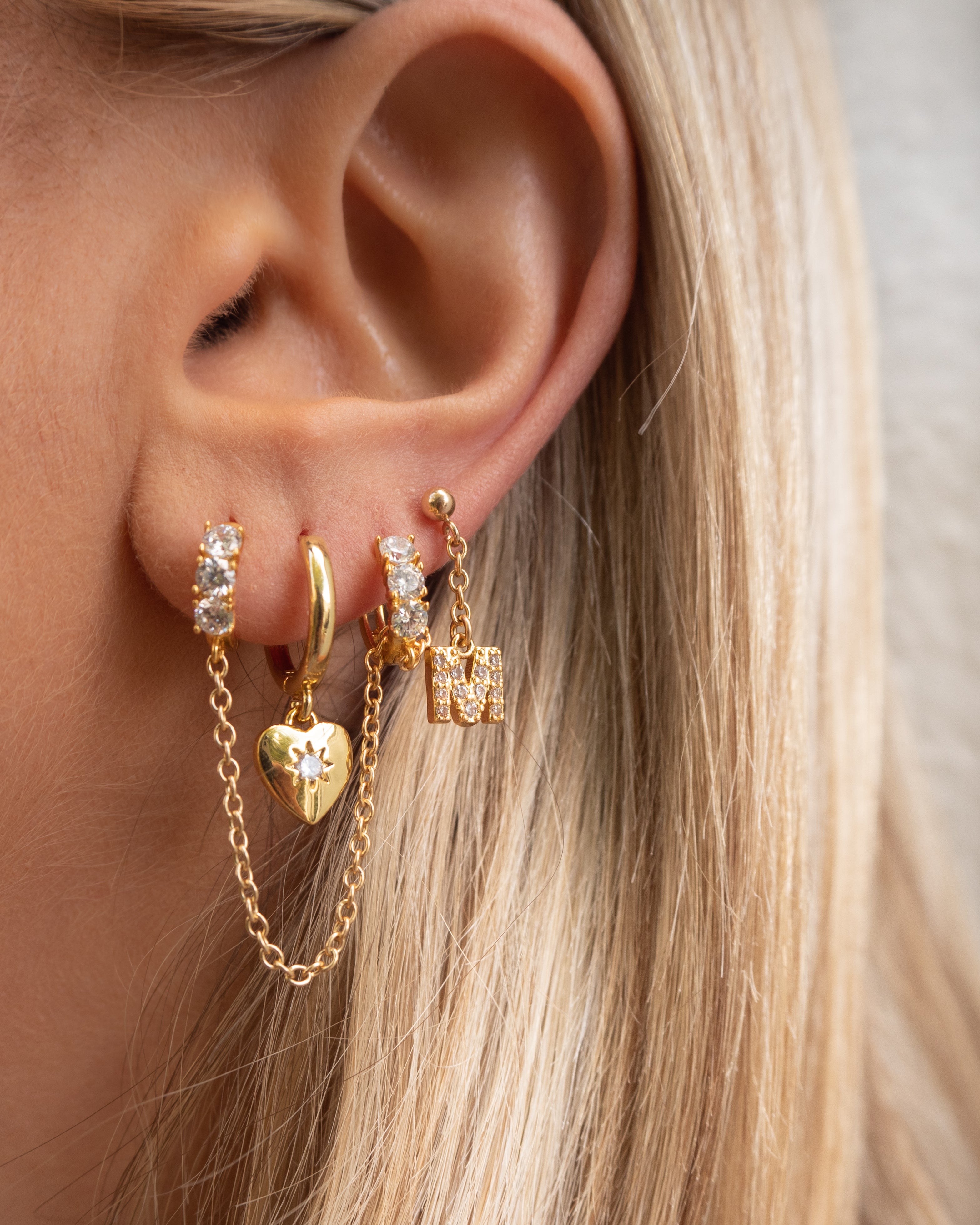 Dainty initial letter charm mini stud drop earrings with chain in 14k gold filled with pave cz diamonds in gold. 