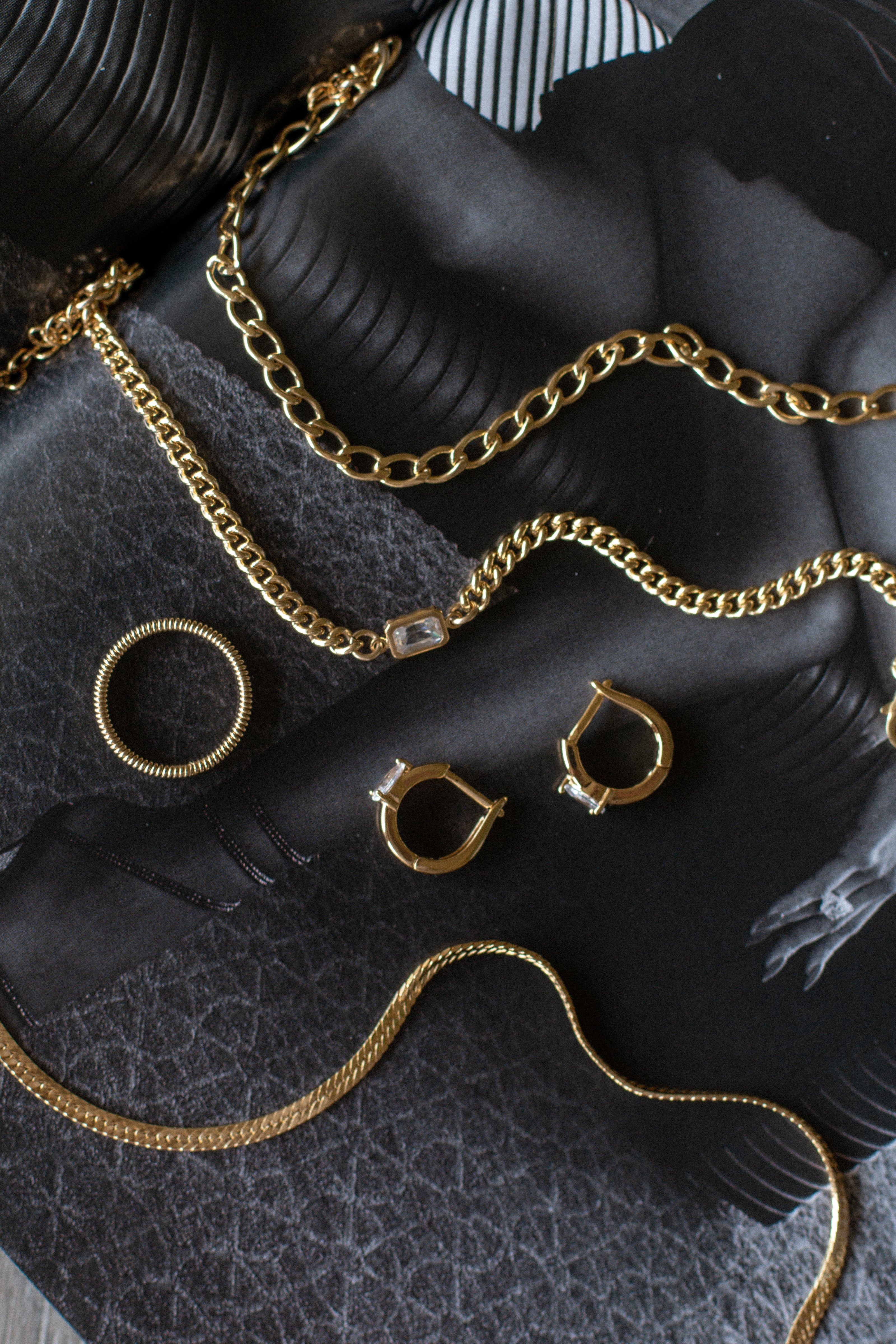 chunky curb chain necklace with dainty herringbone snake chain necklace and huggie hoop earrings in 14k gold filled