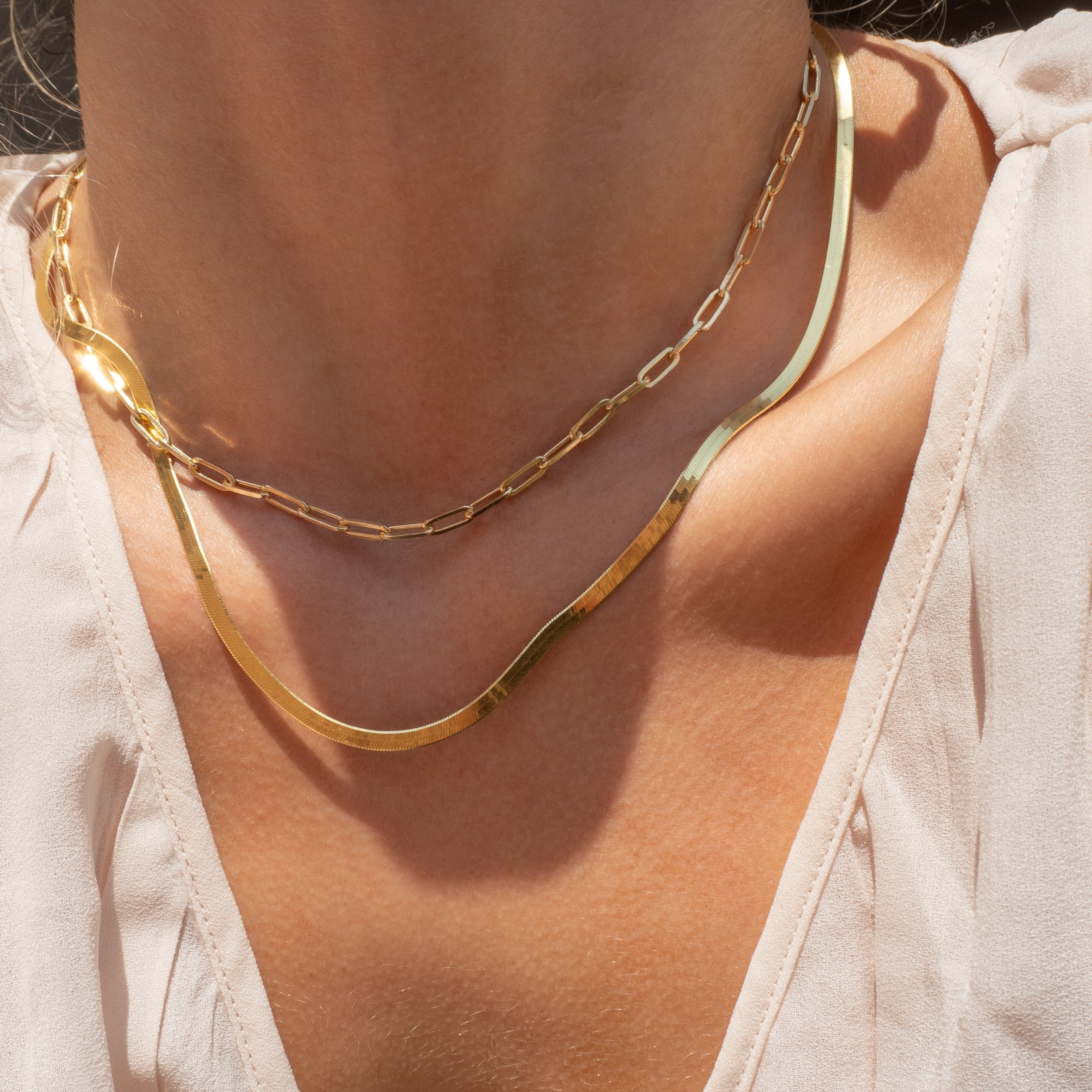 dainty layering chains in 14k gold vermeil by vie en bleu jewelry