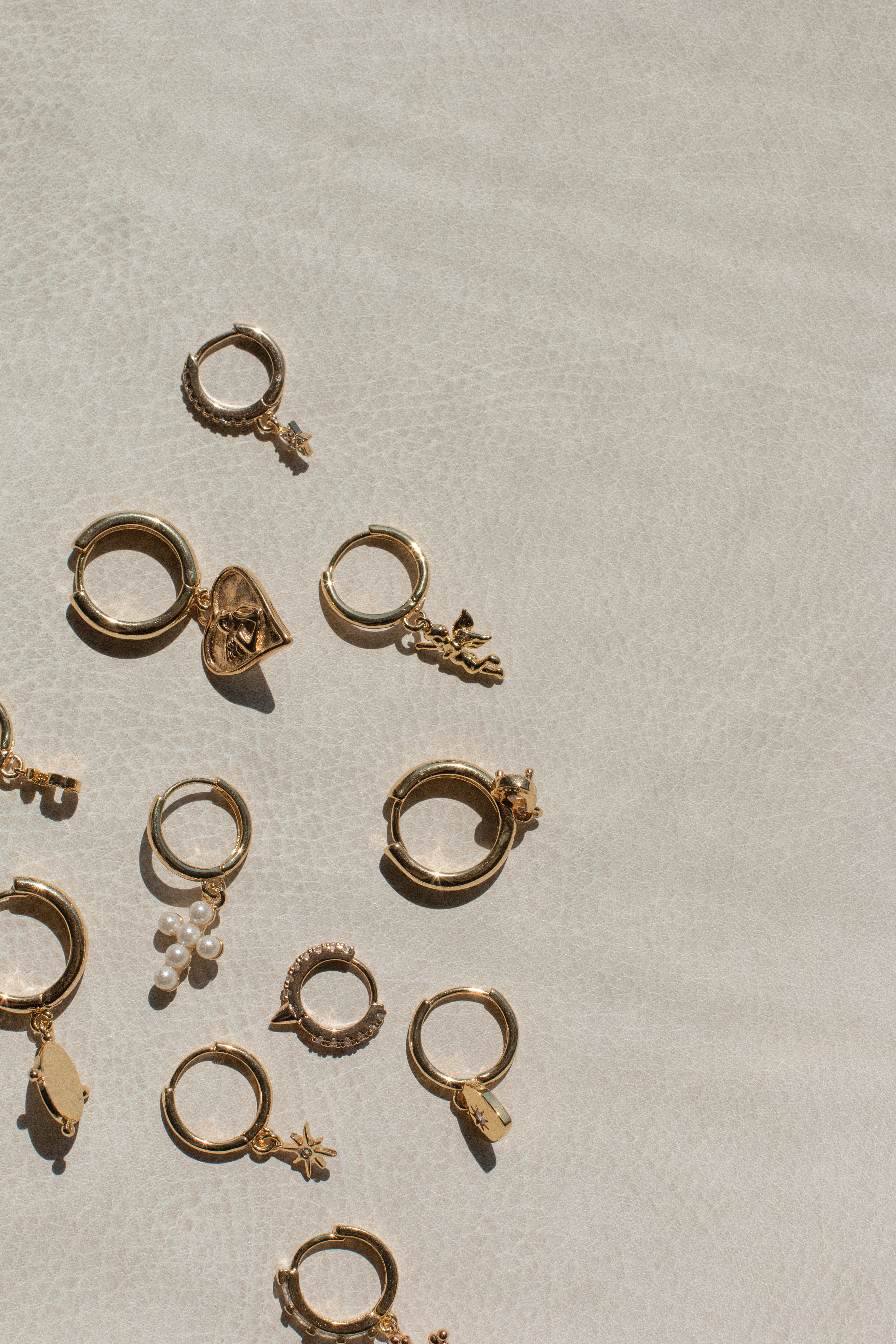 dainty huggie hoops, huggie earrings, gold filled huggie, thin hoop earrings, stacking earrings, stacking hoops, angel earrings, earring with angel, huggie angel charm, dainty hoop earrings, gold filled earirngs